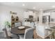 Bright kitchen area with granite countertops and stainless steel appliances and hardwood floors at 445 Sawmill Trce, Hampton, GA 30228
