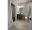 Bathroom with a vanity, toilet, and an open doorway leading to another room, offering practicality and flow at 129 Silvercrest Dr # 57, Acworth, GA 30101