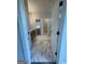Bathroom featuring marble floors, a double vanity, and natural light from the window to the hallway at 129 Silvercrest Dr # 57, Acworth, GA 30101