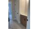 View of a tiled bathroom with a cabinet vanity, sink and adjacent closet space at 129 Silvercrest Dr # 57, Acworth, GA 30101