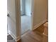 Hallway view into a cozy bedroom featuring plush carpeting and a neutral color scheme at 129 Silvercrest Dr # 57, Acworth, GA 30101