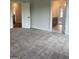 Spacious bedroom with plush carpeting and ensuite bathroom entrance and hallway views at 129 Silvercrest Dr # 57, Acworth, GA 30101