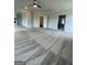 Large bedroom offering neutral paint and carpet, a ceiling fan, and openings to other rooms in the home at 129 Silvercrest Dr # 57, Acworth, GA 30101