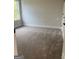 Inviting bedroom with plush carpeting and soft, natural light streaming through a window at 129 Silvercrest Dr # 57, Acworth, GA 30101