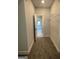 Spacious walk-in closet with neutral carpet, wire shelving, and a window for natural light at 129 Silvercrest Dr # 57, Acworth, GA 30101