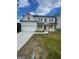 Charming white two-story home with a well-manicured lawn and a two-car garage at 129 Silvercrest Dr # 57, Acworth, GA 30101