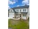 Attractive two-story home featuring a two-car garage, multiple windows, and wooden posts at 129 Silvercrest Dr # 57, Acworth, GA 30101