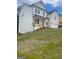 Bright white two-story home with a two-car garage and a partially visible porch at 129 Silvercrest Dr # 57, Acworth, GA 30101