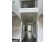 Bright foyer featuring a dark wood floor, trim, and a view of the home's entrance at 129 Silvercrest Dr # 57, Acworth, GA 30101