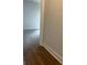 Hallway showing the doorway to a carpeted bedroom at 129 Silvercrest Dr # 57, Acworth, GA 30101