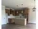 Bright kitchen featuring stainless steel sink, wooden cabinets, and white countertops at 129 Silvercrest Dr # 57, Acworth, GA 30101