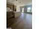 Bright kitchen featuring an island, modern cabinets, pendant lights, and open dining space at 129 Silvercrest Dr # 57, Acworth, GA 30101