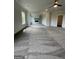 Open living room with a ceiling fan, neutral paint colors, open to a fireplace, and new carpet at 129 Silvercrest Dr # 57, Acworth, GA 30101