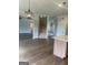 Open-concept living room featuring hardwood floors and staircase to the second floor at 129 Silvercrest Dr # 57, Acworth, GA 30101