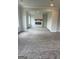 Spacious living room showcases plush carpeting and a cozy fireplace, perfect for relaxation at 129 Silvercrest Dr # 57, Acworth, GA 30101