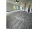 Expansive living room with new carpet, ceiling fan, and open floor plan with plenty of natural light at 129 Silvercrest Dr # 57, Acworth, GA 30101