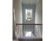 Staircase featuring black metal railings and modern chandelier hanging from ceiling at 129 Silvercrest Dr # 57, Acworth, GA 30101