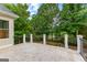 Tiled back deck with wrought iron railing, overlooking the lush green yard at 134 Mellington Ln, Peachtree City, GA 30269
