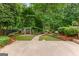 A serene backyard featuring a pergola and stone pavers, offering a peaceful retreat at 134 Mellington Ln, Peachtree City, GA 30269