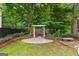 Backyard with a pergola and stone pavers creating a peaceful setting at 134 Mellington Ln, Peachtree City, GA 30269