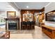 The open bar area features a fireplace and lots of cabinet space, ideal for gatherings and entertaining at 134 Mellington Ln, Peachtree City, GA 30269