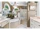 Elegant bathroom featuring marble countertops, a soaking tub, and a glass-enclosed shower at 134 Mellington Ln, Peachtree City, GA 30269
