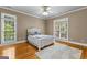 Bright bedroom with hardwood floors, ceiling fan, and lots of natural light at 134 Mellington Ln, Peachtree City, GA 30269