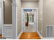 Hallway view into main bedroom featuring hardwood floors and stylish ceiling at 134 Mellington Ln, Peachtree City, GA 30269
