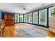 Spacious dining room features beautiful blue accent wall with large windows and hardwood floors at 134 Mellington Ln, Peachtree City, GA 30269