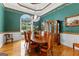 Dining area featuring custom millwork, hardwood floors, and view from a large window at 134 Mellington Ln, Peachtree City, GA 30269