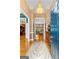 View of the foyer with hardwood floors, a chandelier, and view into the formal living room at 134 Mellington Ln, Peachtree City, GA 30269