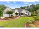 Charming one story home with three car garage, beautifully landscaped yard and stone accents at 134 Mellington Ln, Peachtree City, GA 30269