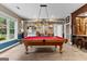 The game room includes a pool table and wet bar area, providing versatile recreation and hosting options at 134 Mellington Ln, Peachtree City, GA 30269