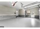 Spacious and clean garage with painted floor and room for multiple cars at 134 Mellington Ln, Peachtree City, GA 30269