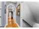 Hallway with hardwood floors, and stairway with white subway tile wall at 134 Mellington Ln, Peachtree City, GA 30269