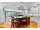 Spacious kitchen featuring a central island, white cabinets, and stainless steel appliances at 134 Mellington Ln, Peachtree City, GA 30269