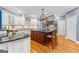 Charming kitchen with a large island, stainless steel appliances, and hardwood floors at 134 Mellington Ln, Peachtree City, GA 30269