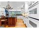 Bright kitchen with white cabinetry, an island, and modern appliances at 134 Mellington Ln, Peachtree City, GA 30269