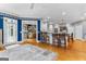 Open floor plan showing kitchen with white cabinets, island and hardwood floors at 134 Mellington Ln, Peachtree City, GA 30269