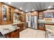 Well-equipped kitchenette boasting stainless steel appliances, stone countertops, and stylish cabinets at 134 Mellington Ln, Peachtree City, GA 30269