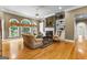Cozy living room featuring a marble fireplace, hardwood floors, and large windows at 134 Mellington Ln, Peachtree City, GA 30269