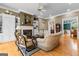 Bright living room with hardwood floors, fireplace, built-in shelves, and elegant furniture at 134 Mellington Ln, Peachtree City, GA 30269