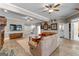 Relax in this cozy living room featuring a fireplace and an entertainment area with natural light at 134 Mellington Ln, Peachtree City, GA 30269