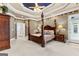 Spacious main bedroom with stylish ceiling, hardwood floors and french door access to backyard at 134 Mellington Ln, Peachtree City, GA 30269