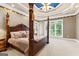 Main bedroom features stylish ceiling with ceiling fan, large windows and king bed at 134 Mellington Ln, Peachtree City, GA 30269