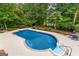 In-ground pool with diving board, set in a private backyard setting with mature trees at 134 Mellington Ln, Peachtree City, GA 30269