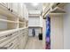 Spacious walk-in closet featuring custom shelving and ample storage, ideal for organization at 134 Mellington Ln, Peachtree City, GA 30269