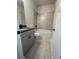 Bathroom with gray tiled shower and floors and gray vanity cabinet at 149 Silvercrest Dr # 58, Acworth, GA 30101