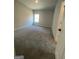 Bedroom with gray carpet, recessed lighting, and one window at 149 Silvercrest Dr # 58, Acworth, GA 30101