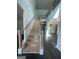 Grand foyer with beautiful hardwood floors and stairs leading to an open second floor at 149 Silvercrest Dr # 58, Acworth, GA 30101
